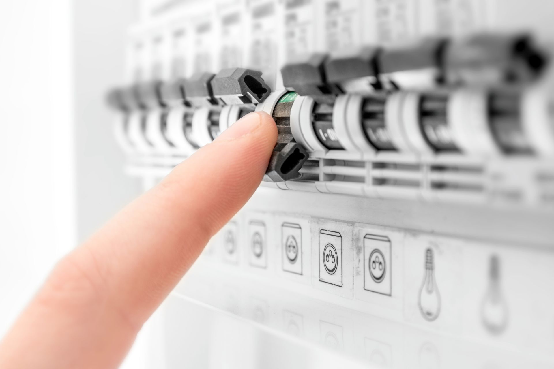 Electricity circuit breaker blown fuses human hand close-up.