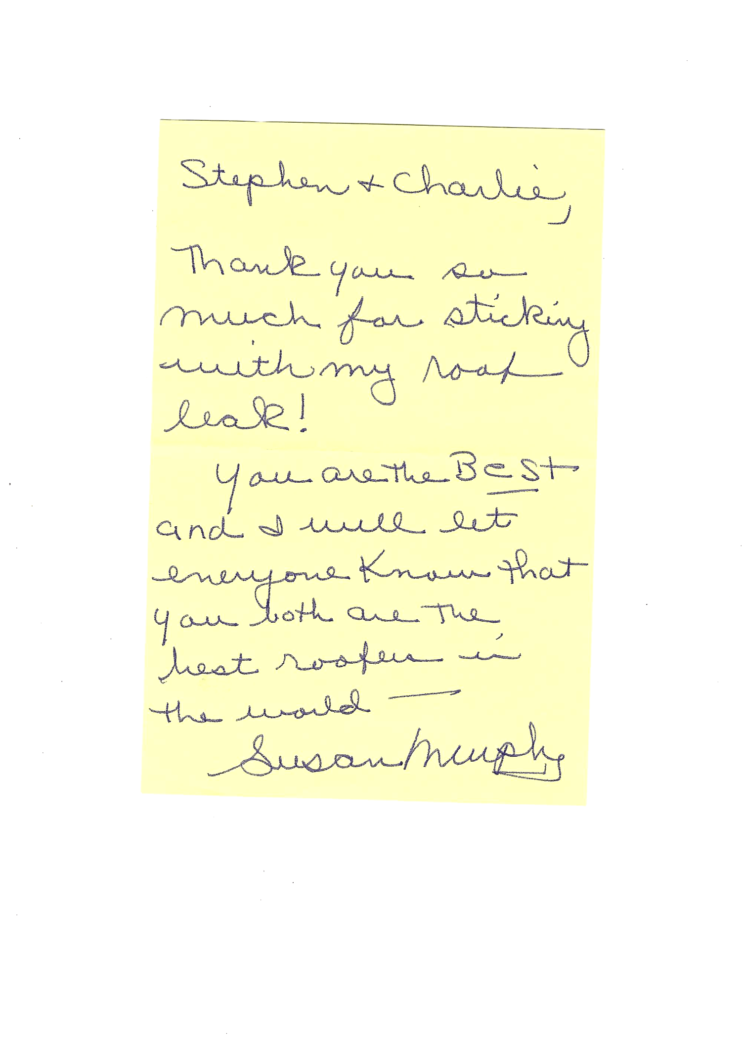 a yellow piece of paper with handwritten text on it .