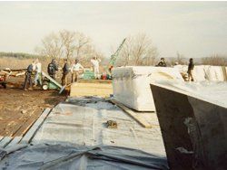 a group of people are working on a construction site .