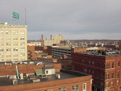 an aerial view of a city with a snb sign on top of a building