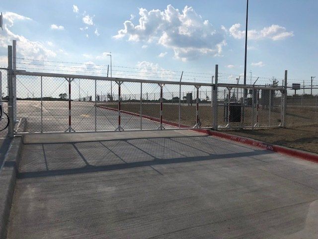 A fence with a red stripe on the side of it