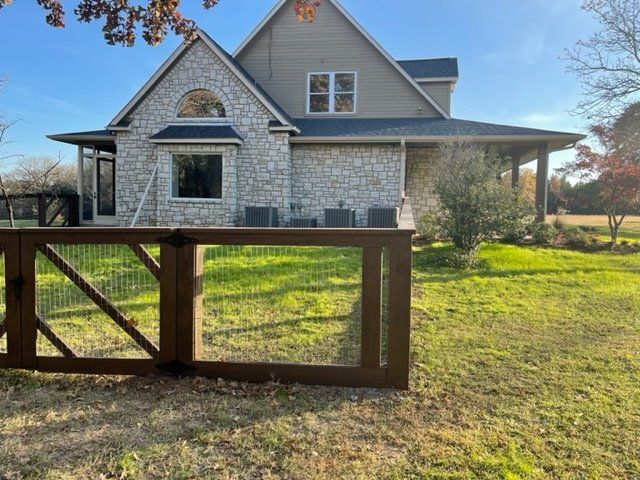 A house with a fence in front of it