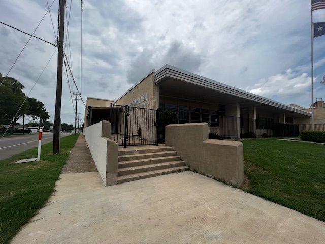 A large building with stairs leading up to it