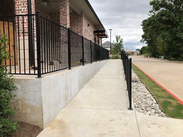 A brick building with a ramp leading to it