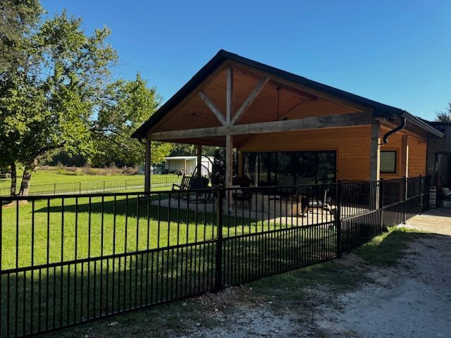A house with a fence in front of it