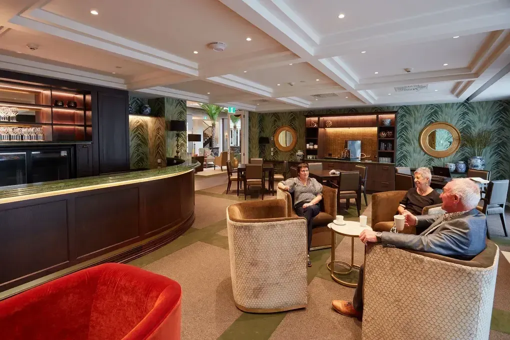 Residents socialising in village lounge bar