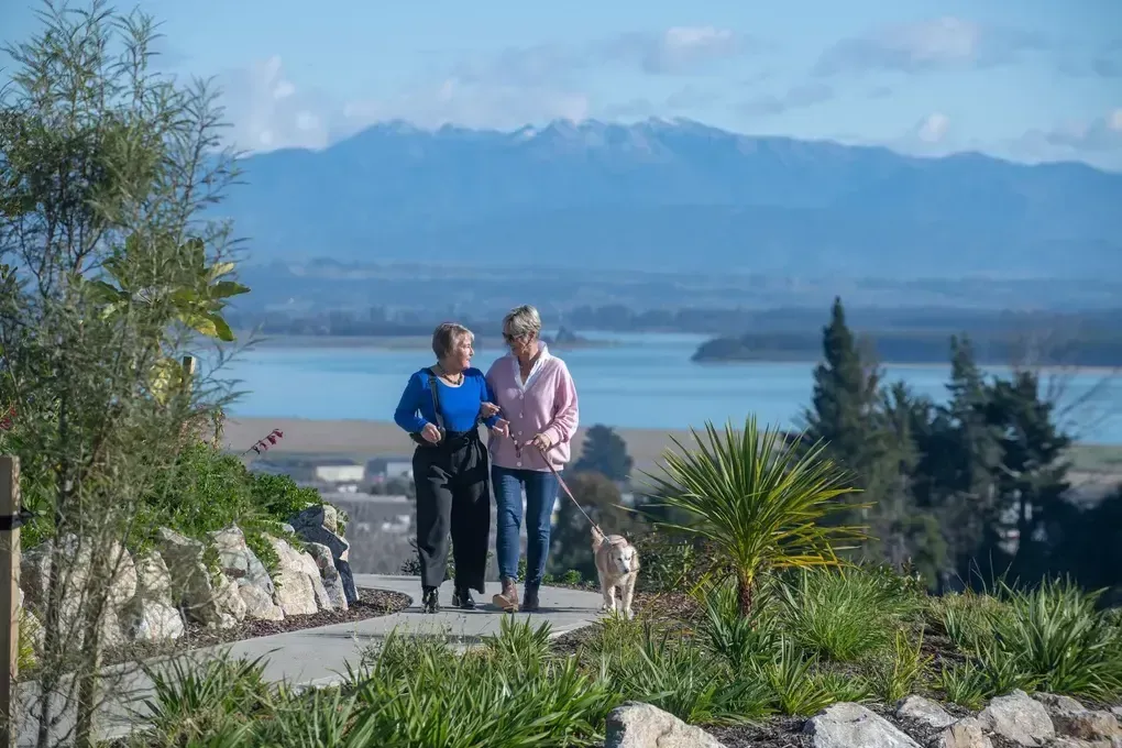 Residents walking at Qestral village
