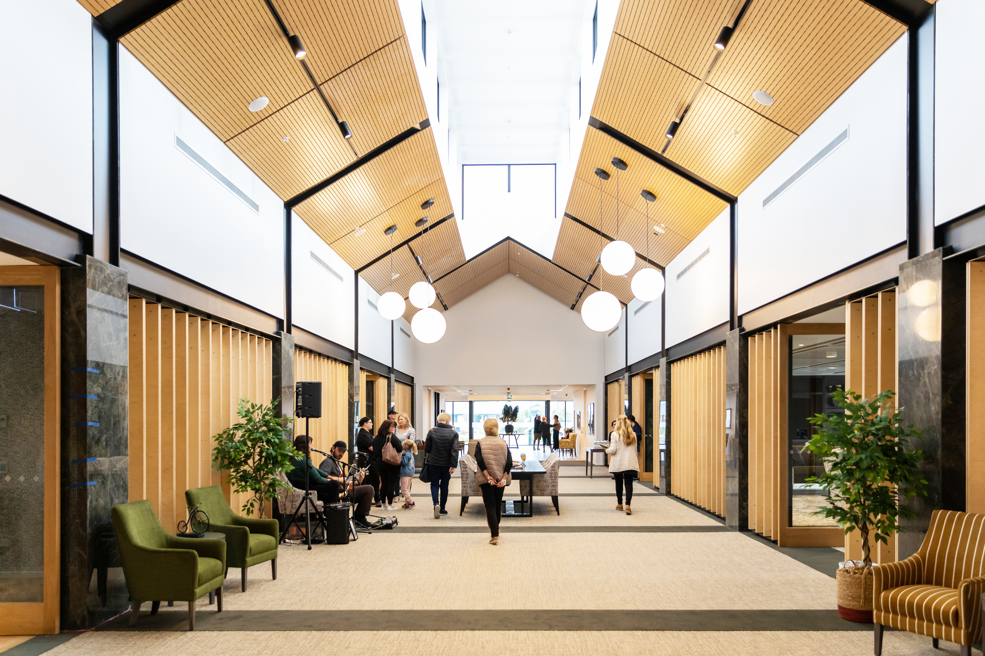 Residents socialising in village atrium