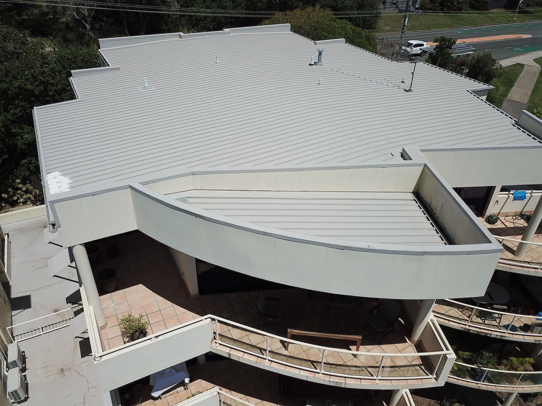 The Roof Of A House With A Chimney And A Skylight — Coastal Roof & Gutter Services In Coolum Beach, QLD