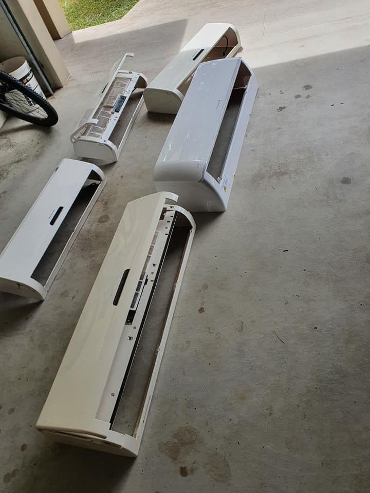 An Air Conditioner Covers on A Concrete Surface — Coach That Cleans in Edmonton, QLD