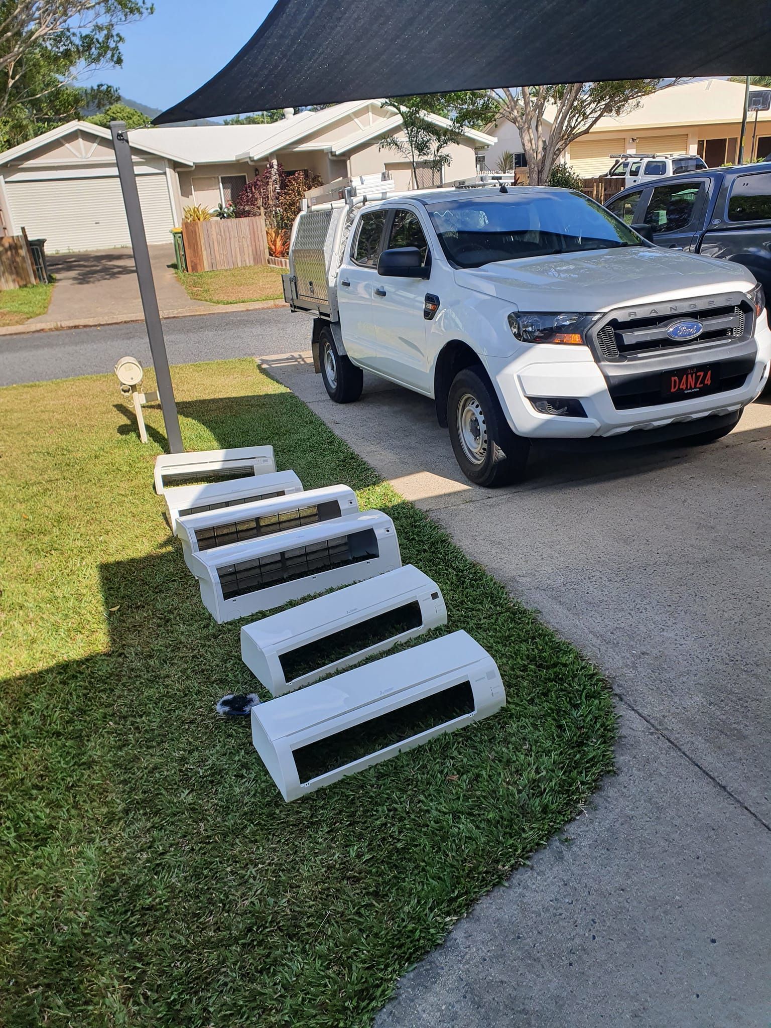 A Truck Parked Next to Air Conditioning Units — Coach That Cleans in Speewah, QLD