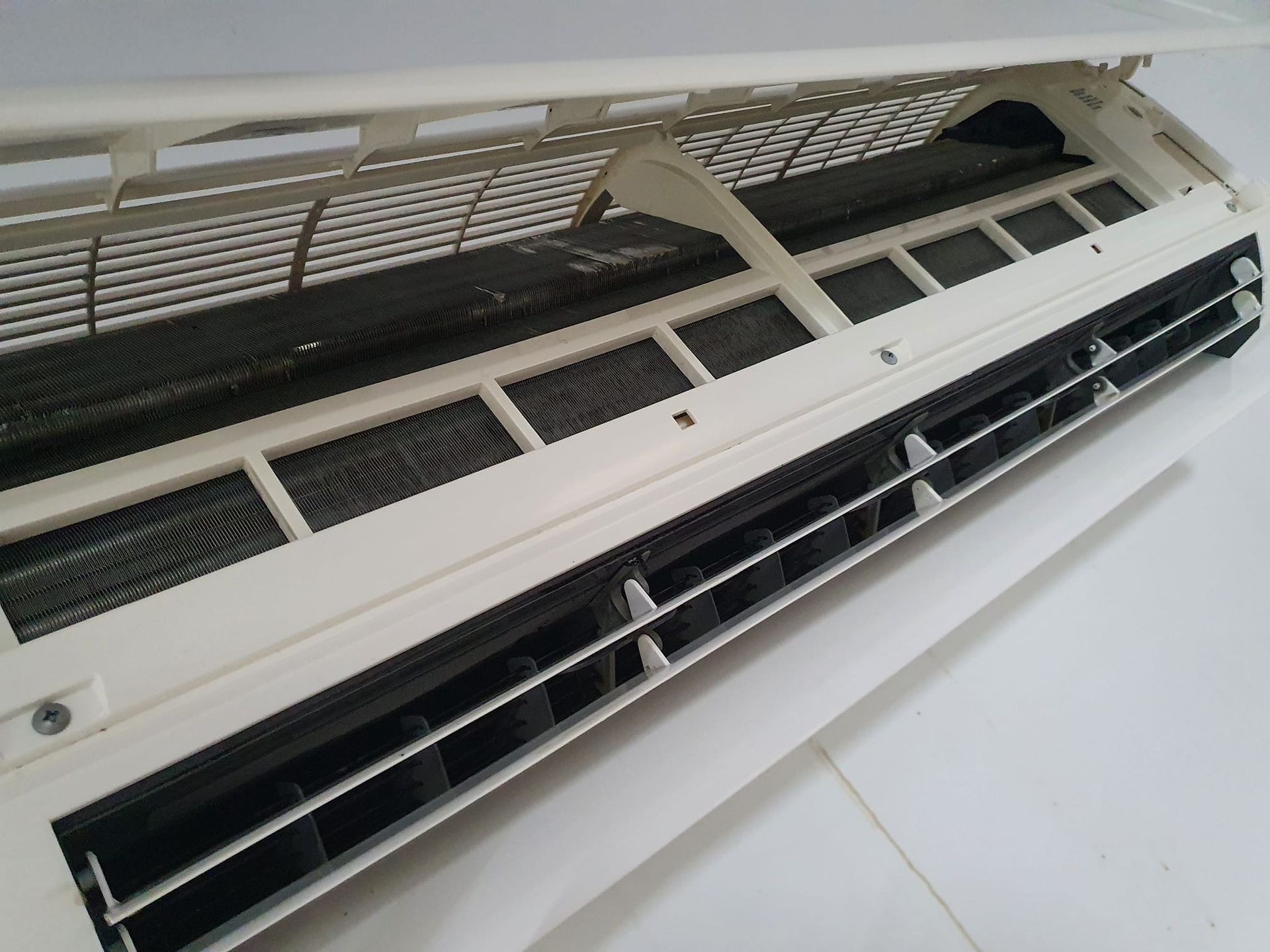 An Air Conditioner Unit with Filter — Coach That Cleans in Speewah, QLD