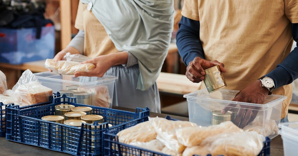 A group of people are preparing food in a kitchen.