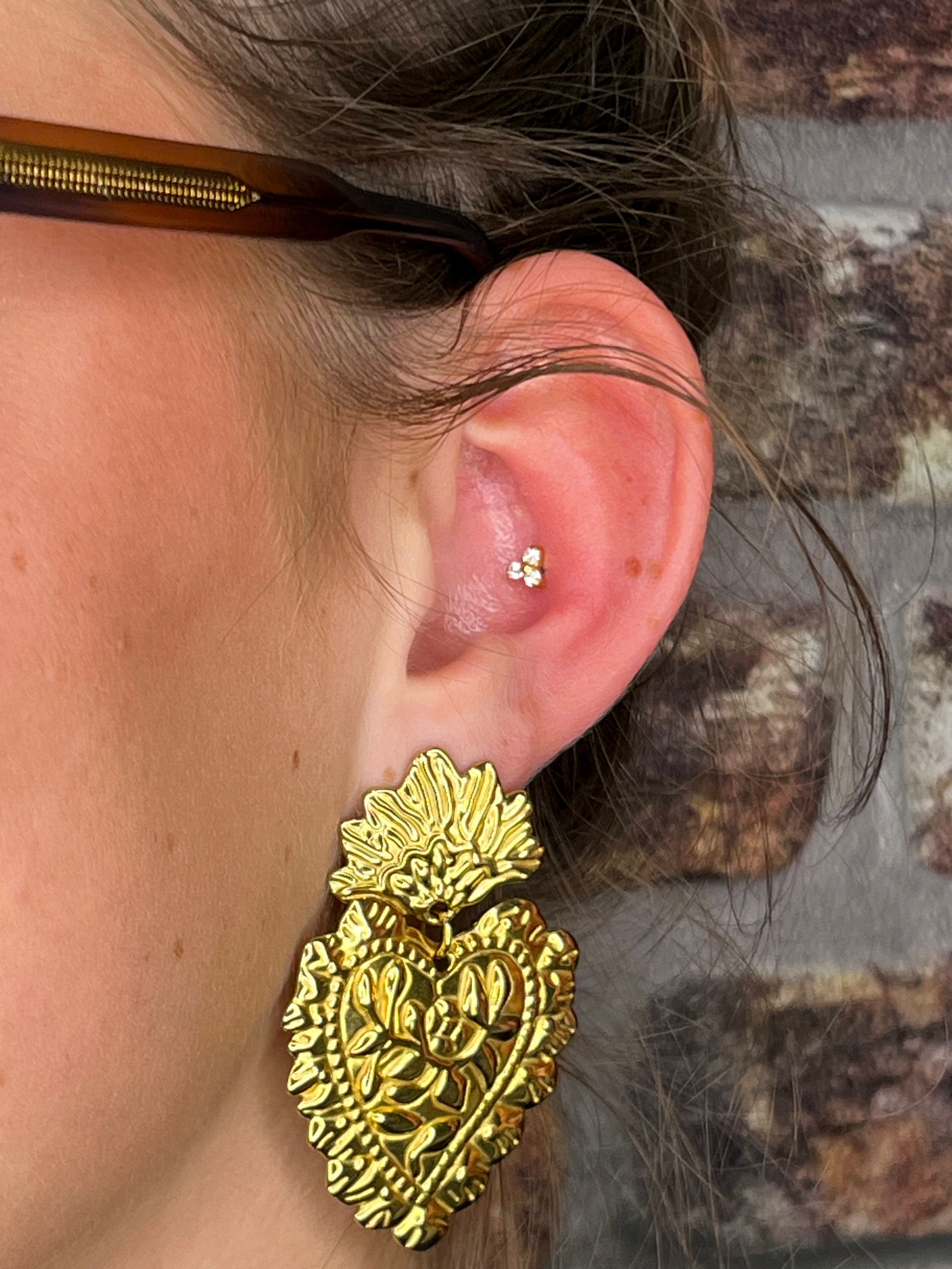 Conch piercing zetten Kampen