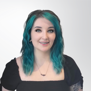 A woman with blue hair is wearing a black shirt and a necklace