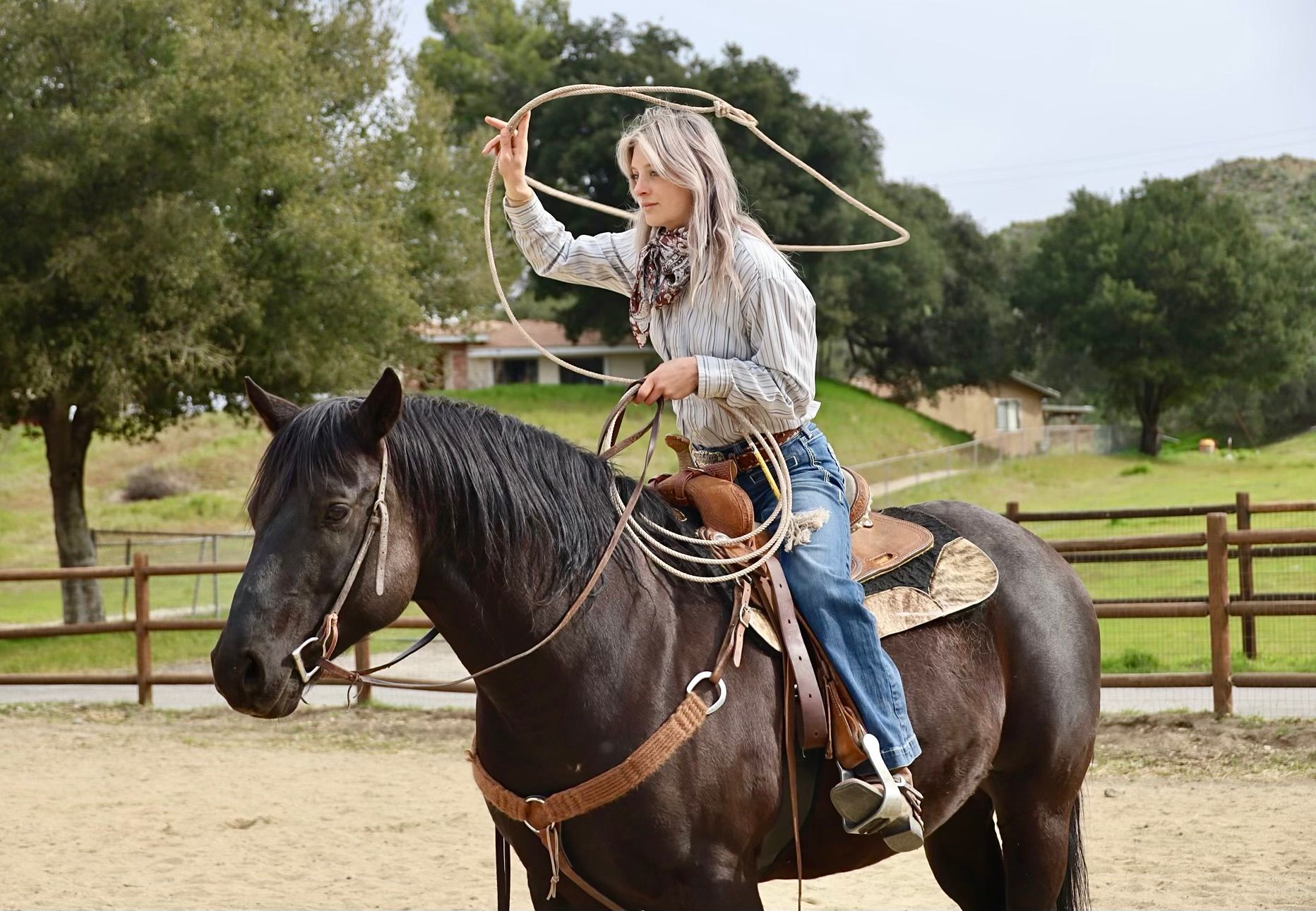 girl roping off a horse