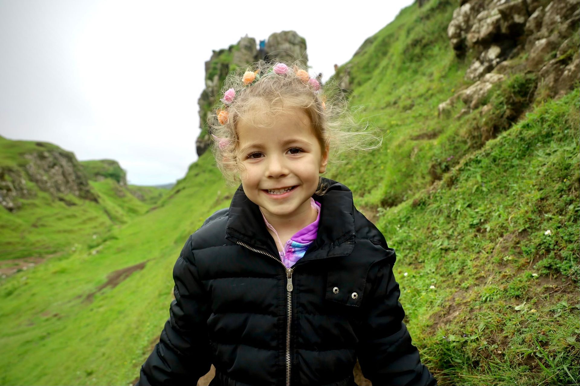 young girl in green field 