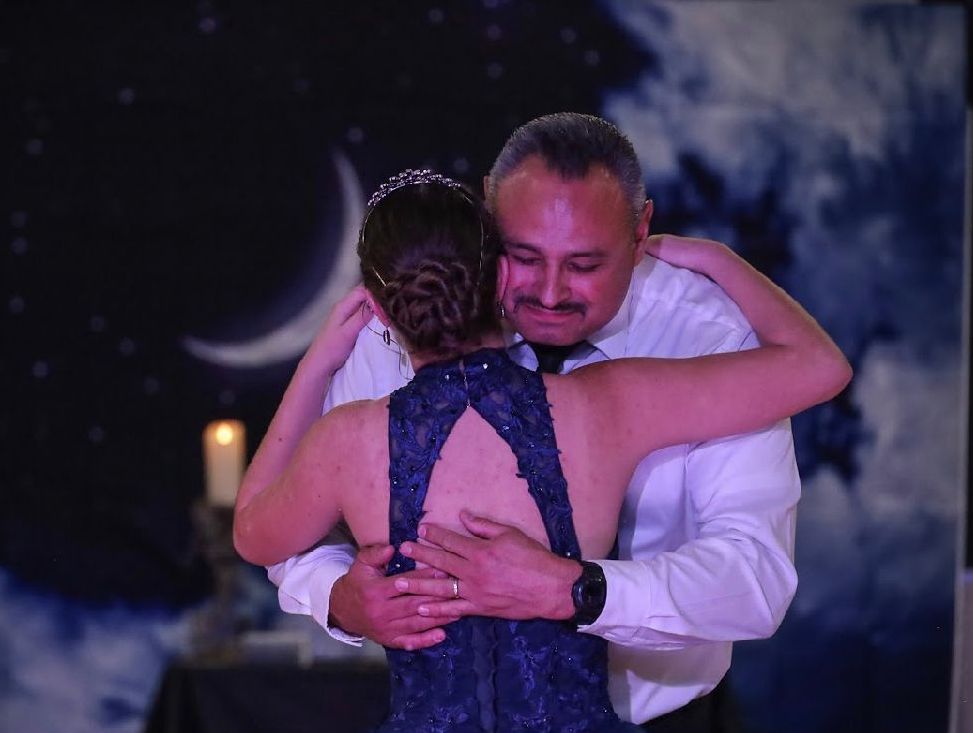 father holding child