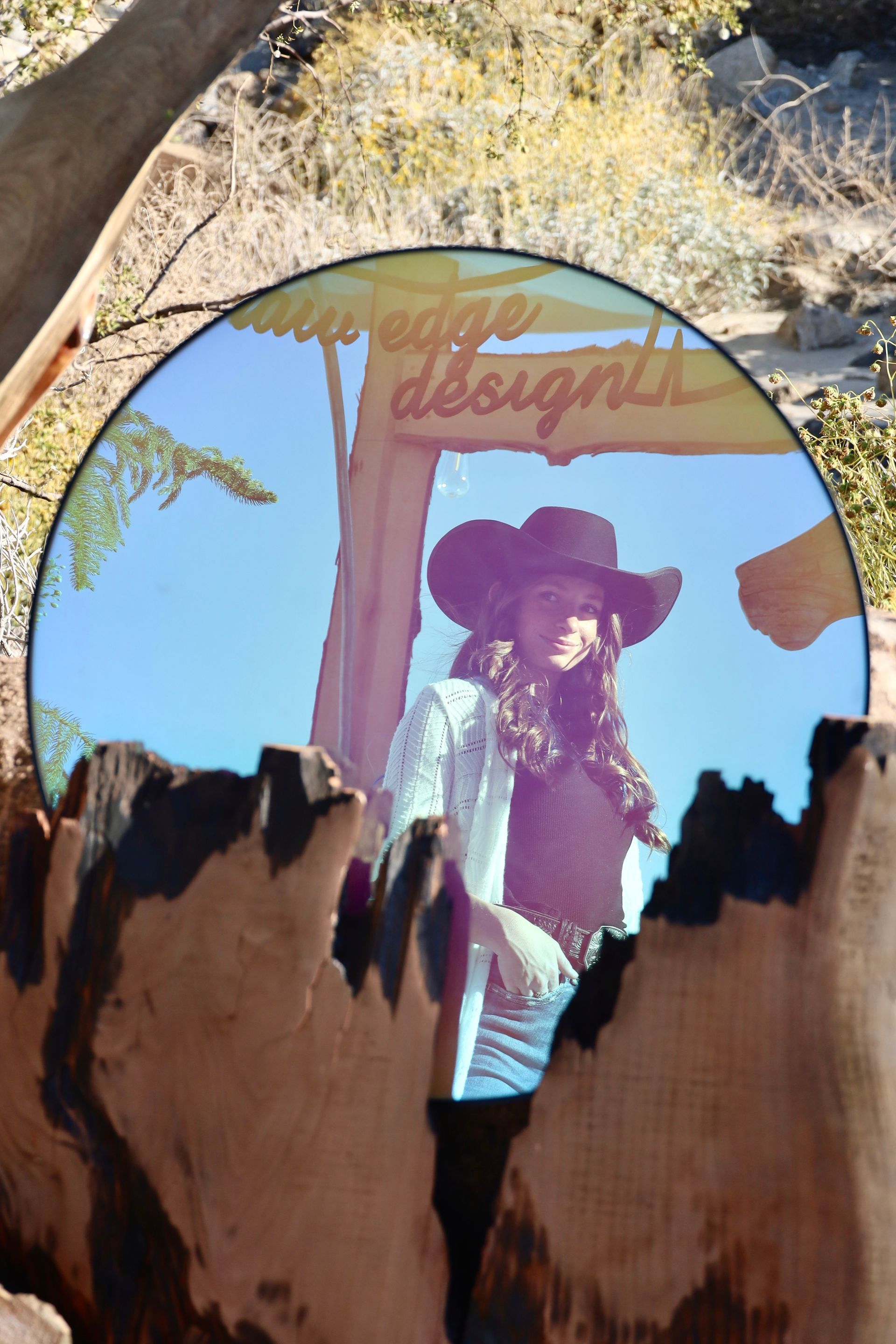 cowgirl admioring herself in mirror