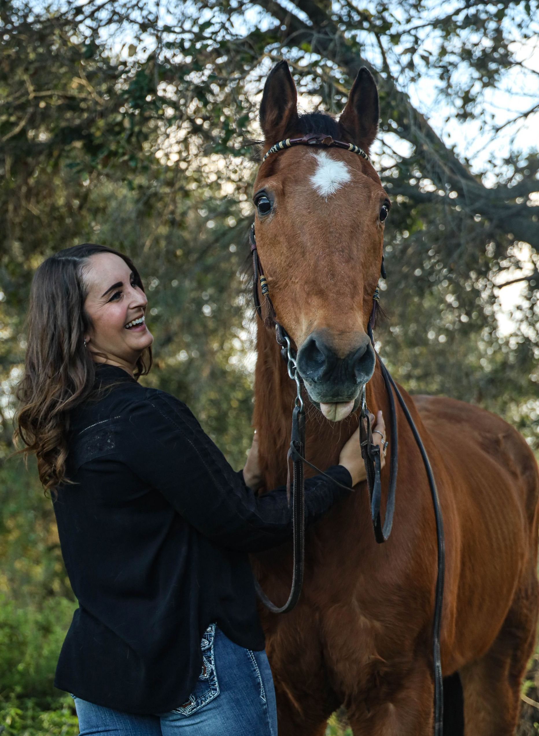 girl smiling at horse