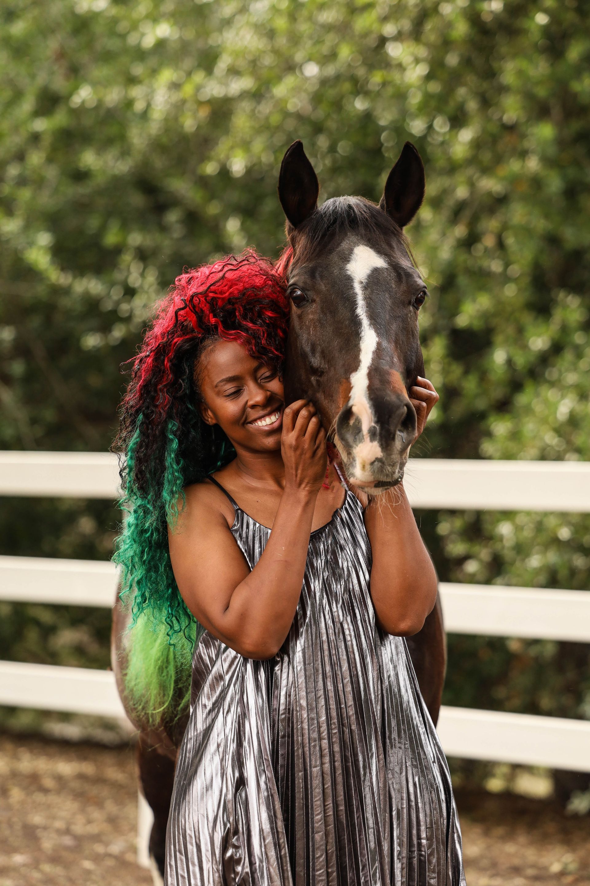 girl smiling at horse