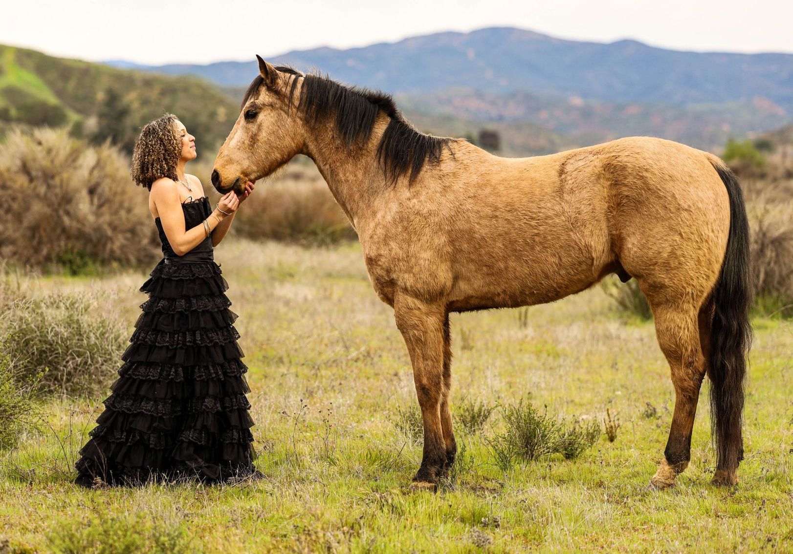 horse and girl in a valley