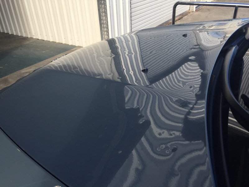 Front Bonnet Black Car With Hail Damage— Dent Magic in Coffs Harbour, NSW
