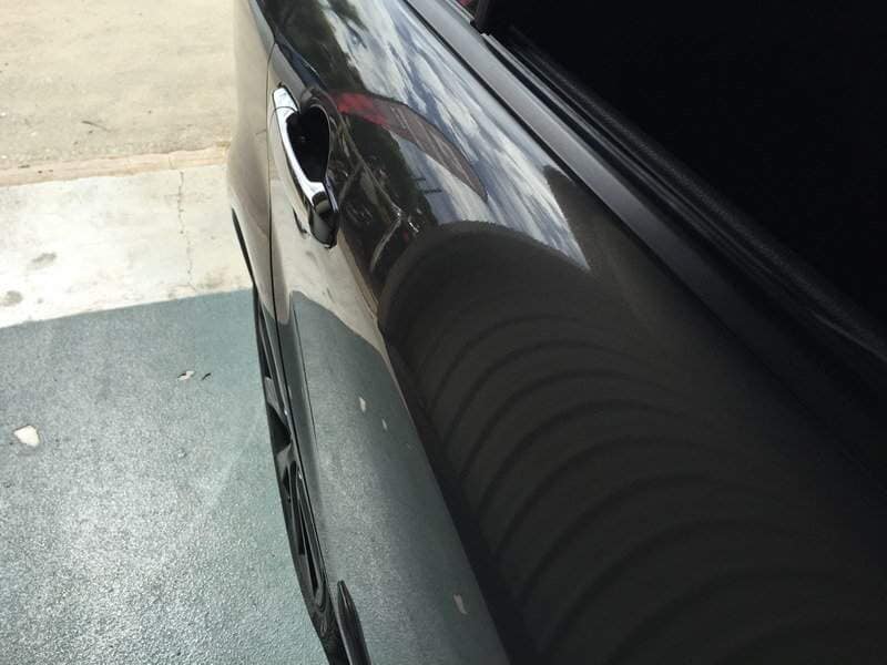 side view of a black car(after) — Dent Magic in Coffs Harbour, NSW