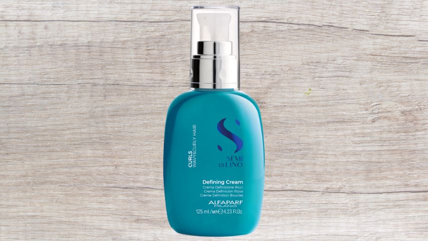 A Blue Bottle of Shampoo is Sitting on a Wooden Table — Superb Hair in Wyong, NSW