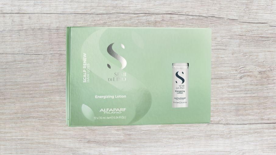 A Box of Alfaparf Hair Products is Sitting on a Wooden Table — Superb Hair in Wyong, NSW