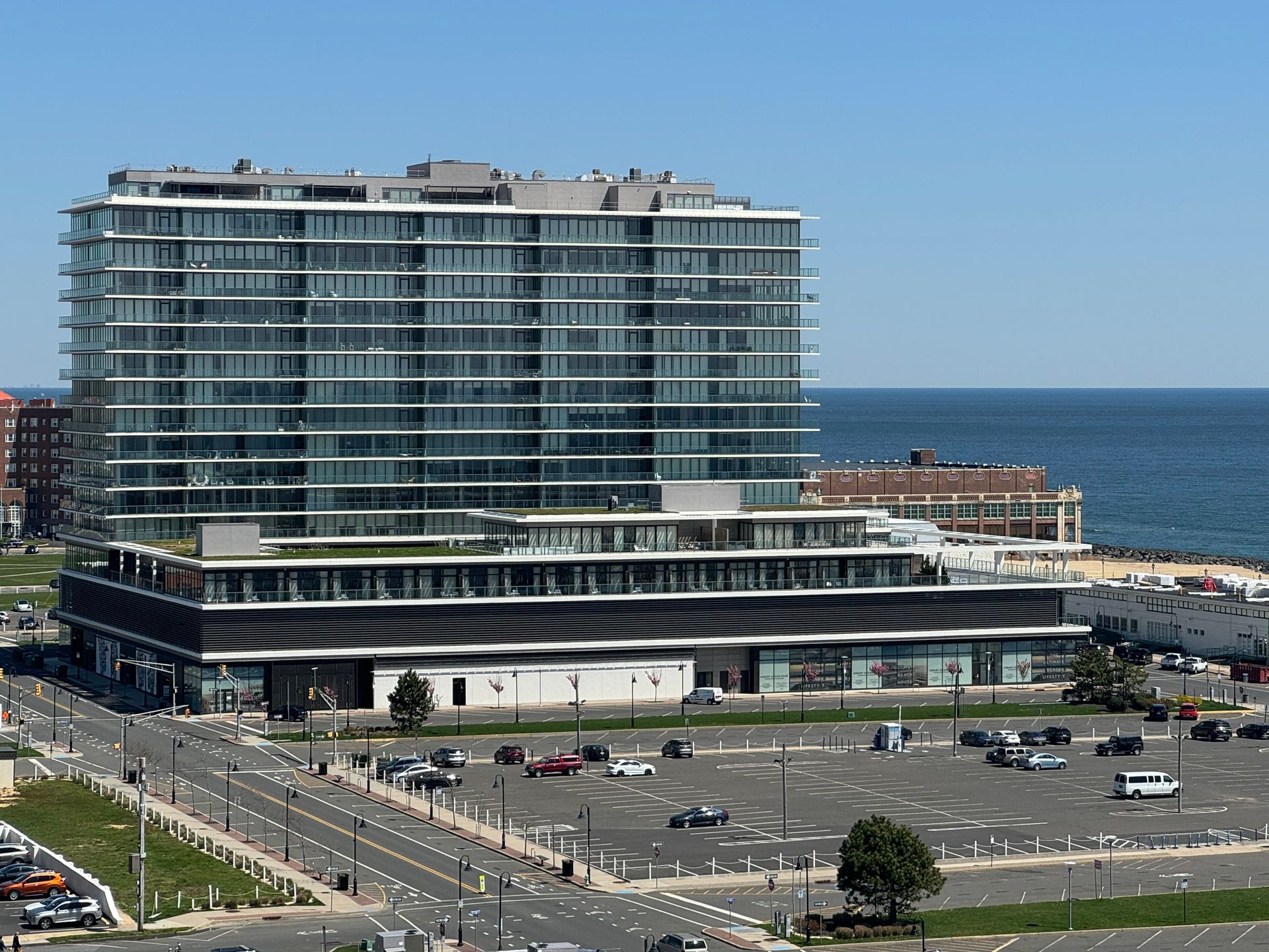 A large building with a parking lot in front of it