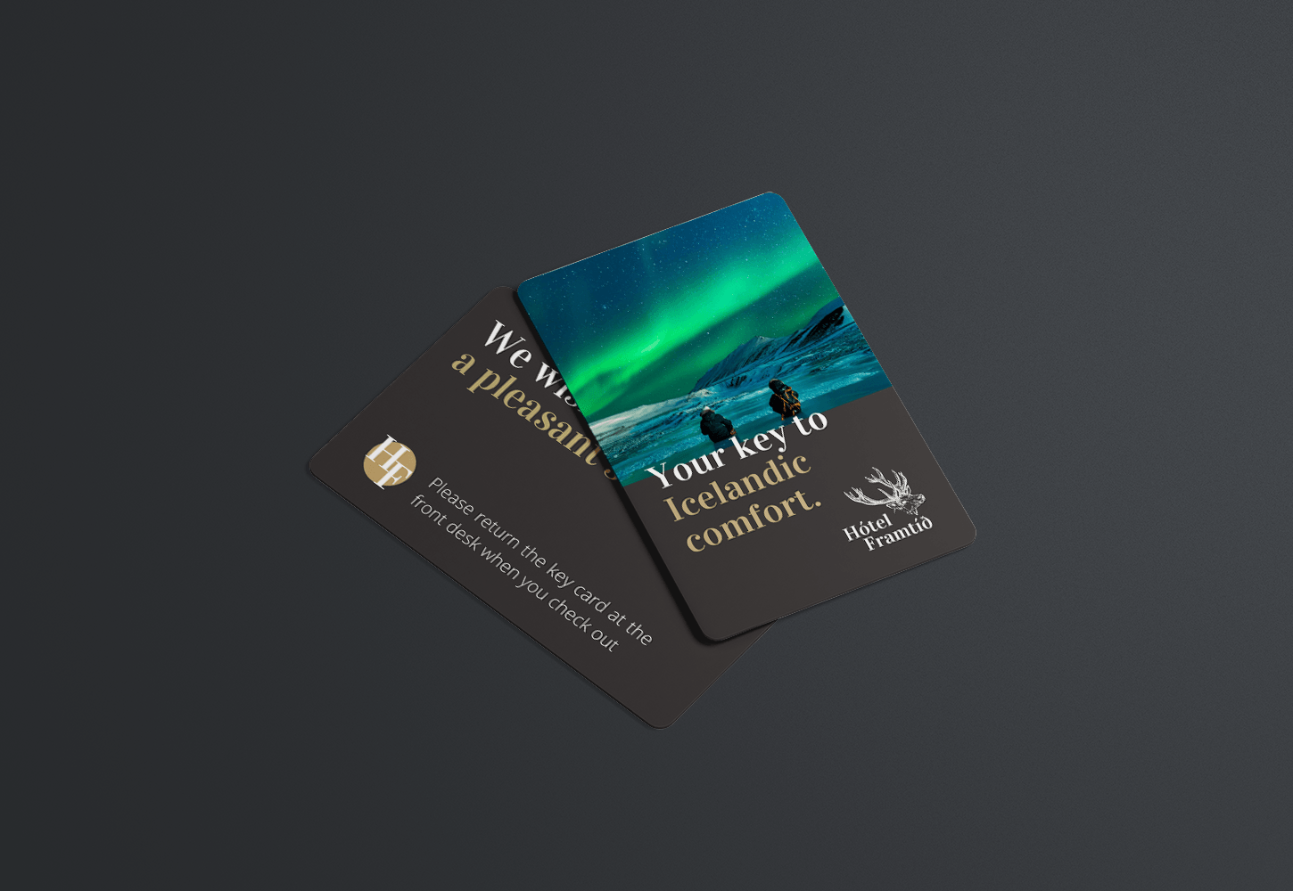 Two hotel key cards with a picture of the aurora borealis on them
