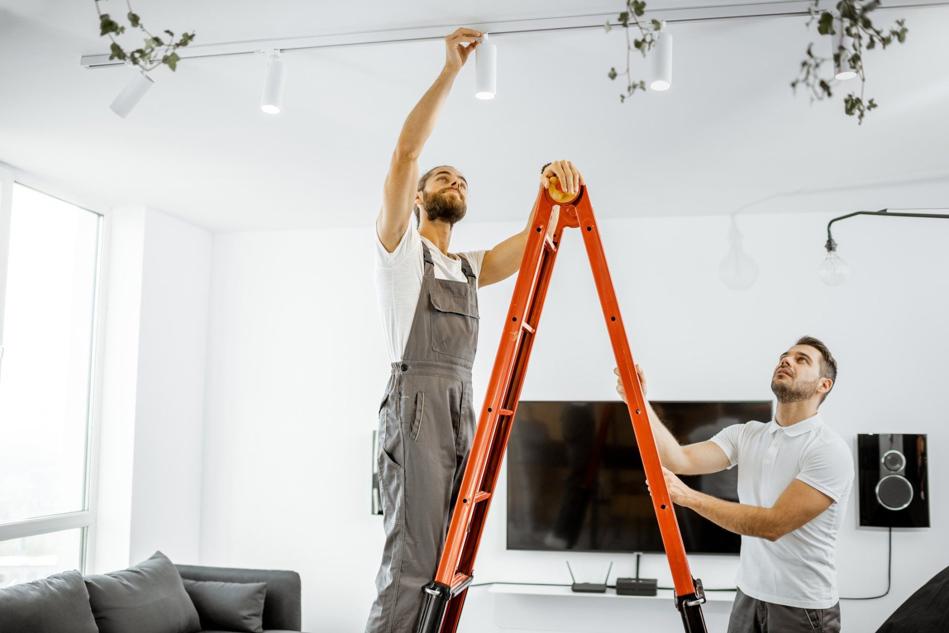 Emergency Electrician — Men Installing Lights at Home in Chesterfield, VA