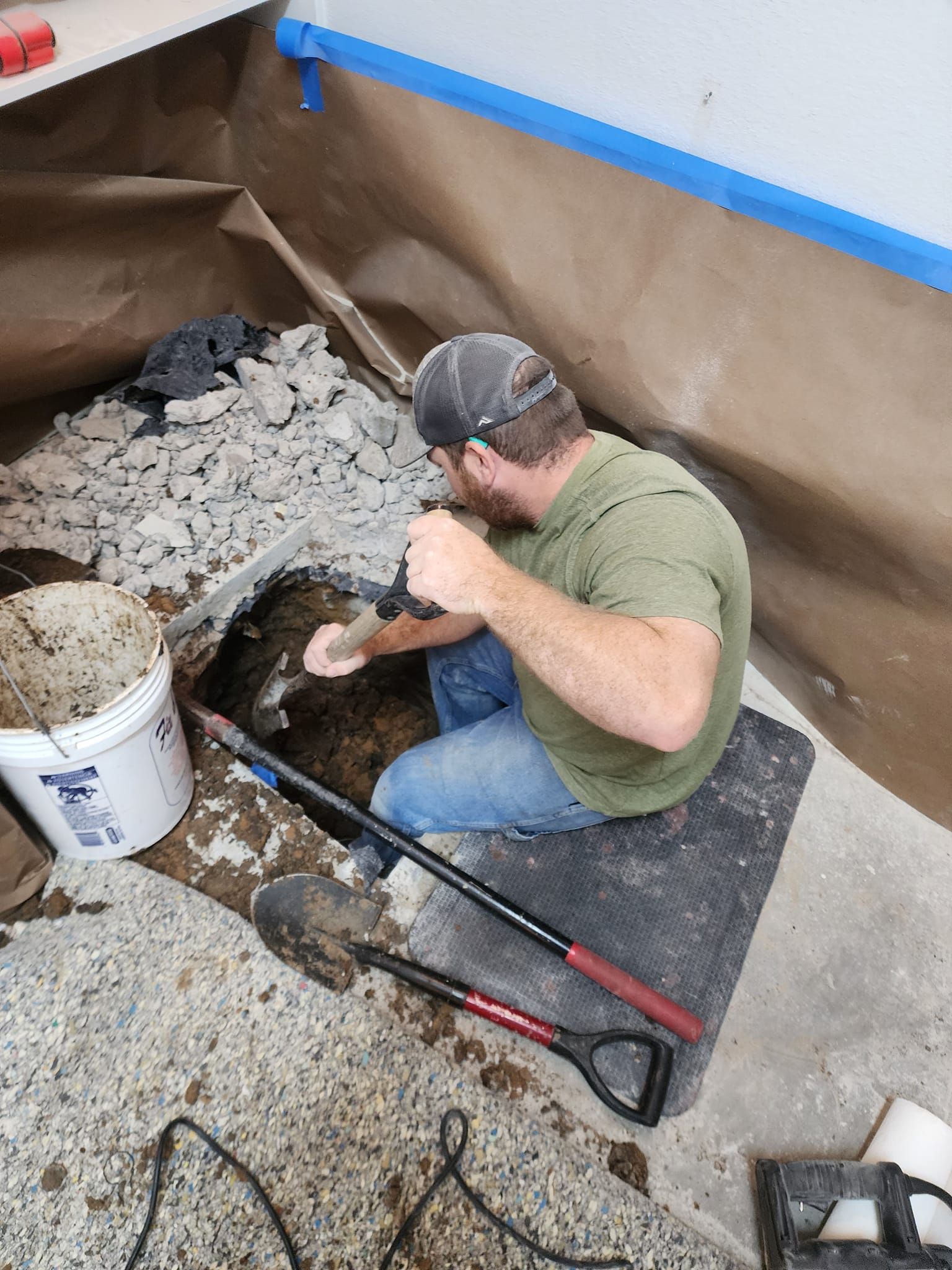 Man uses a drill in a construction project.
