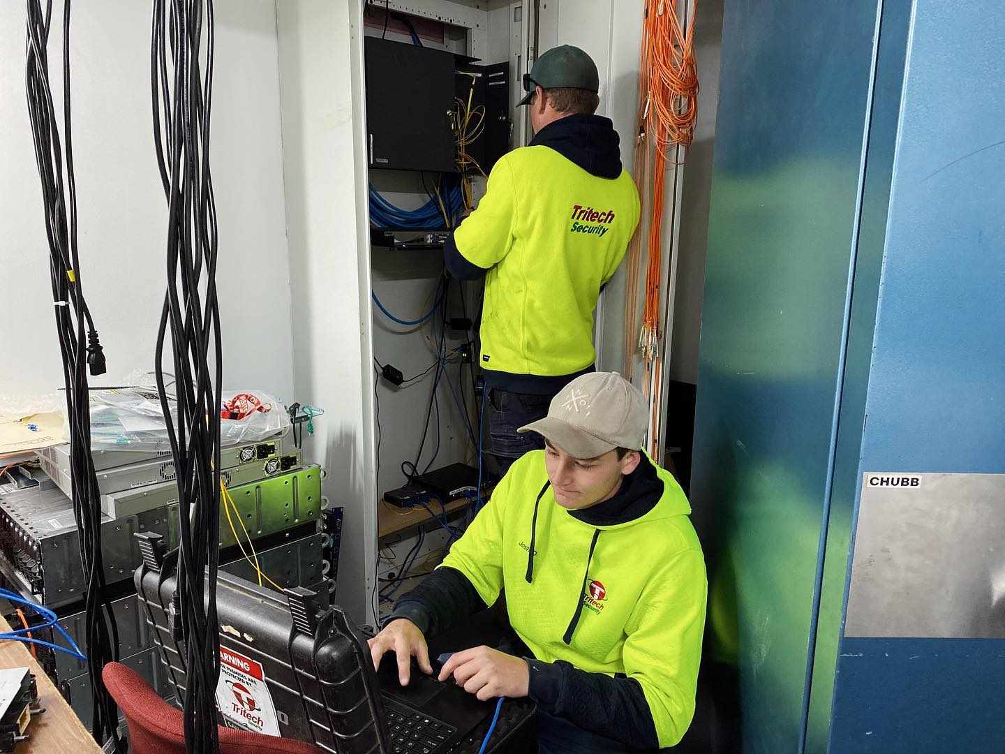 Two workers installing security system — Security Systems in Armidale, NSW