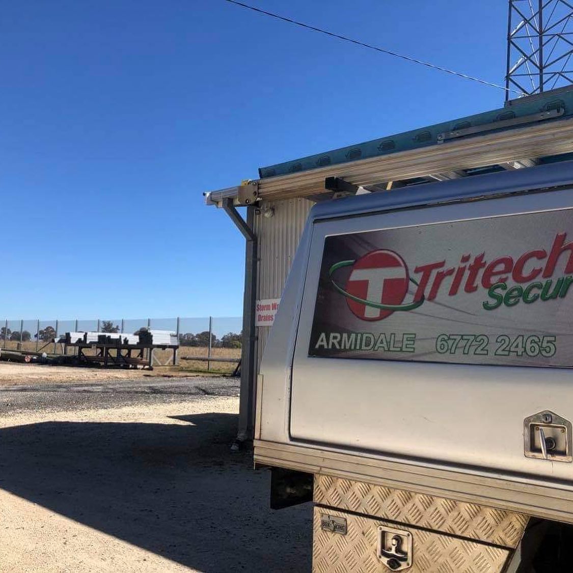 Van with company logo painted behind— Security Systems in Armidale, NSW