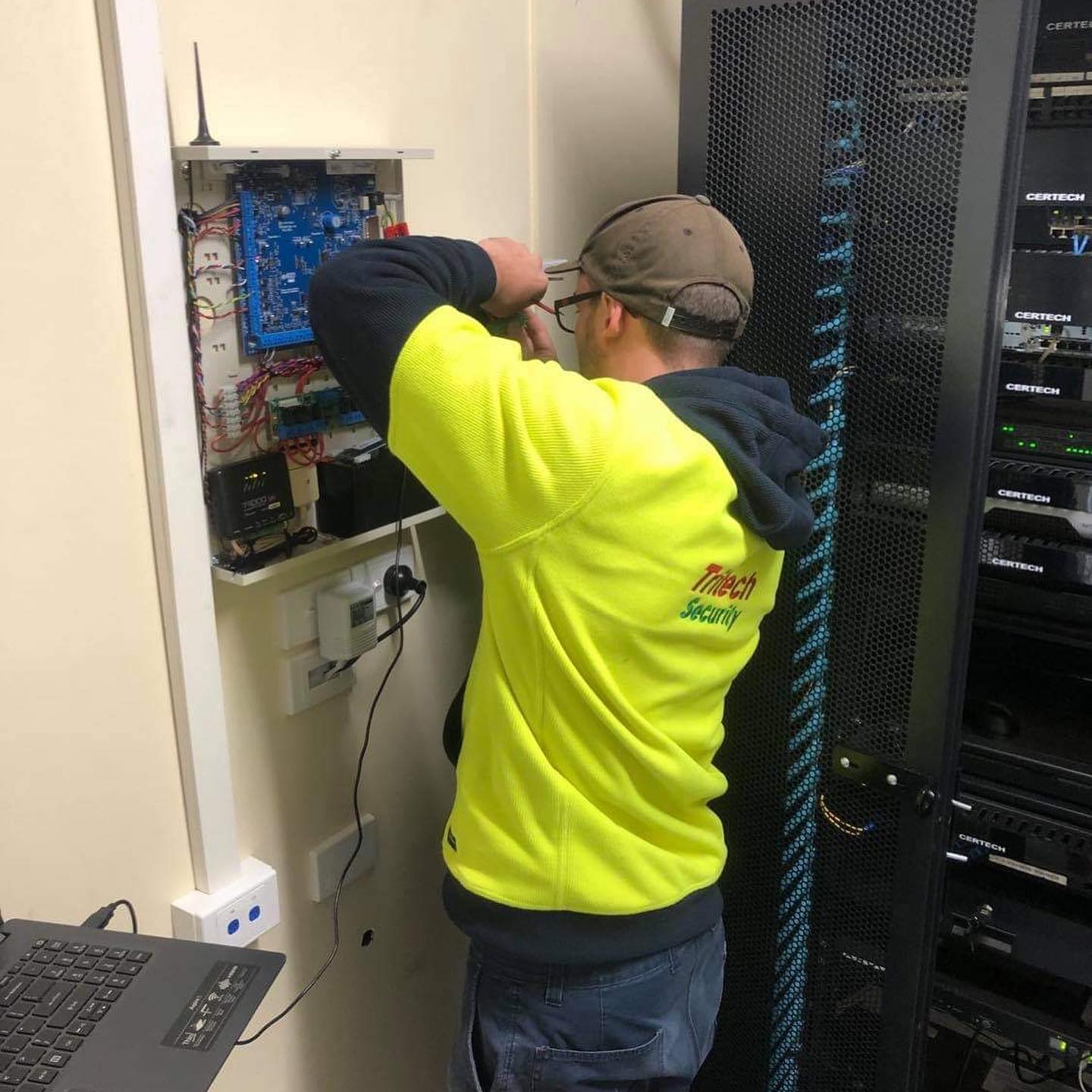 Worker fixing some fuse— Security Systems in Armidale, NSW
