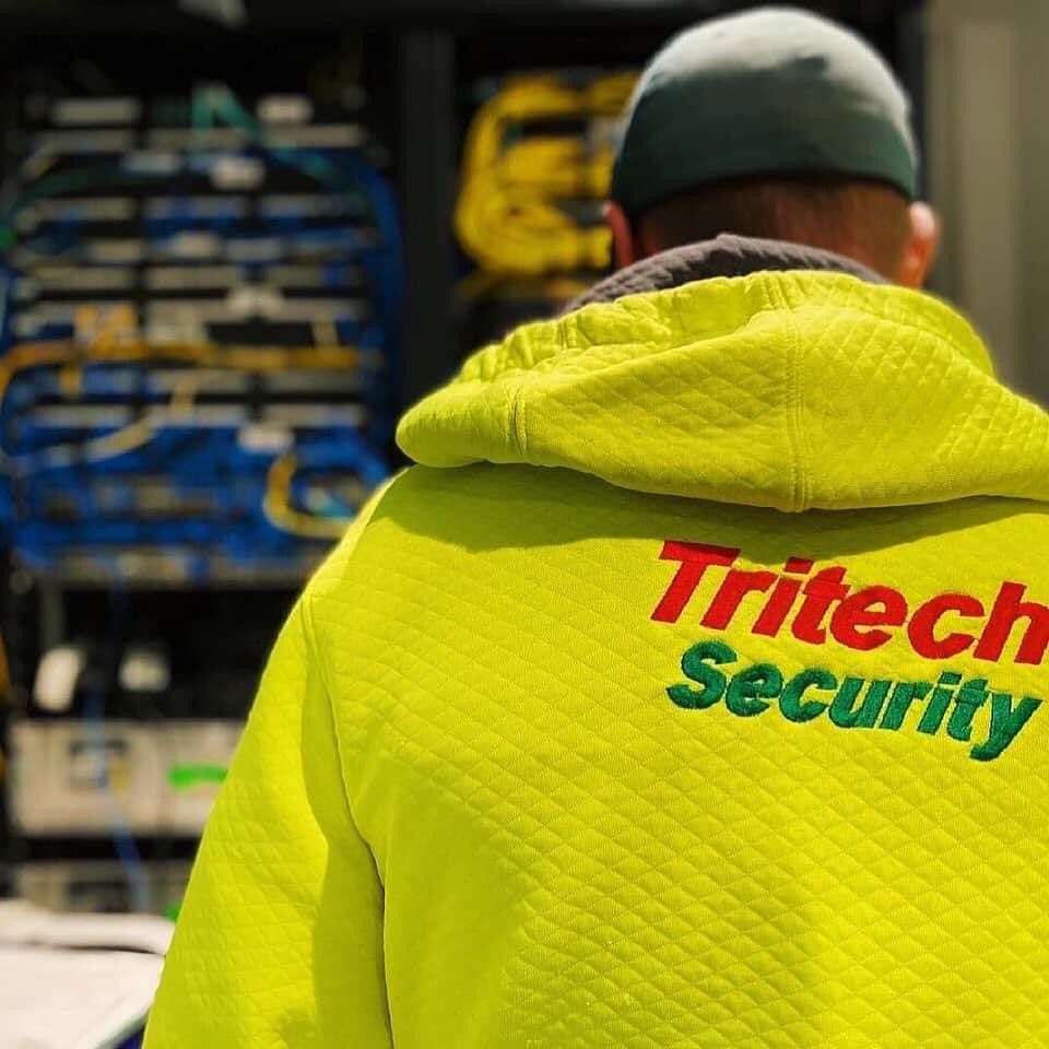 Security worker wearing yellow jacket — Security Systems in Armidale, NSW