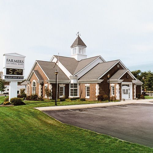 A brick building with a sign that says farmers on it