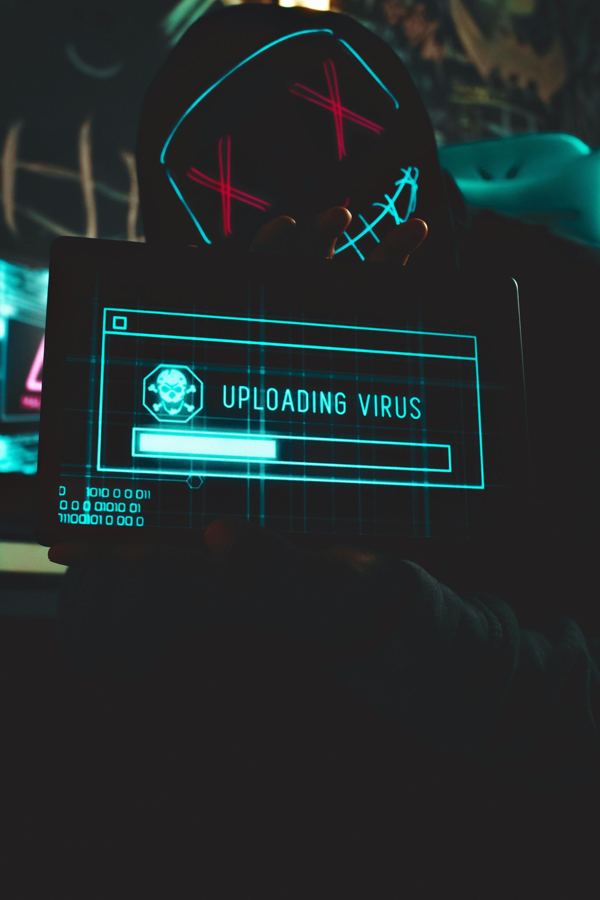 A person wearing a mask with the word virus on it