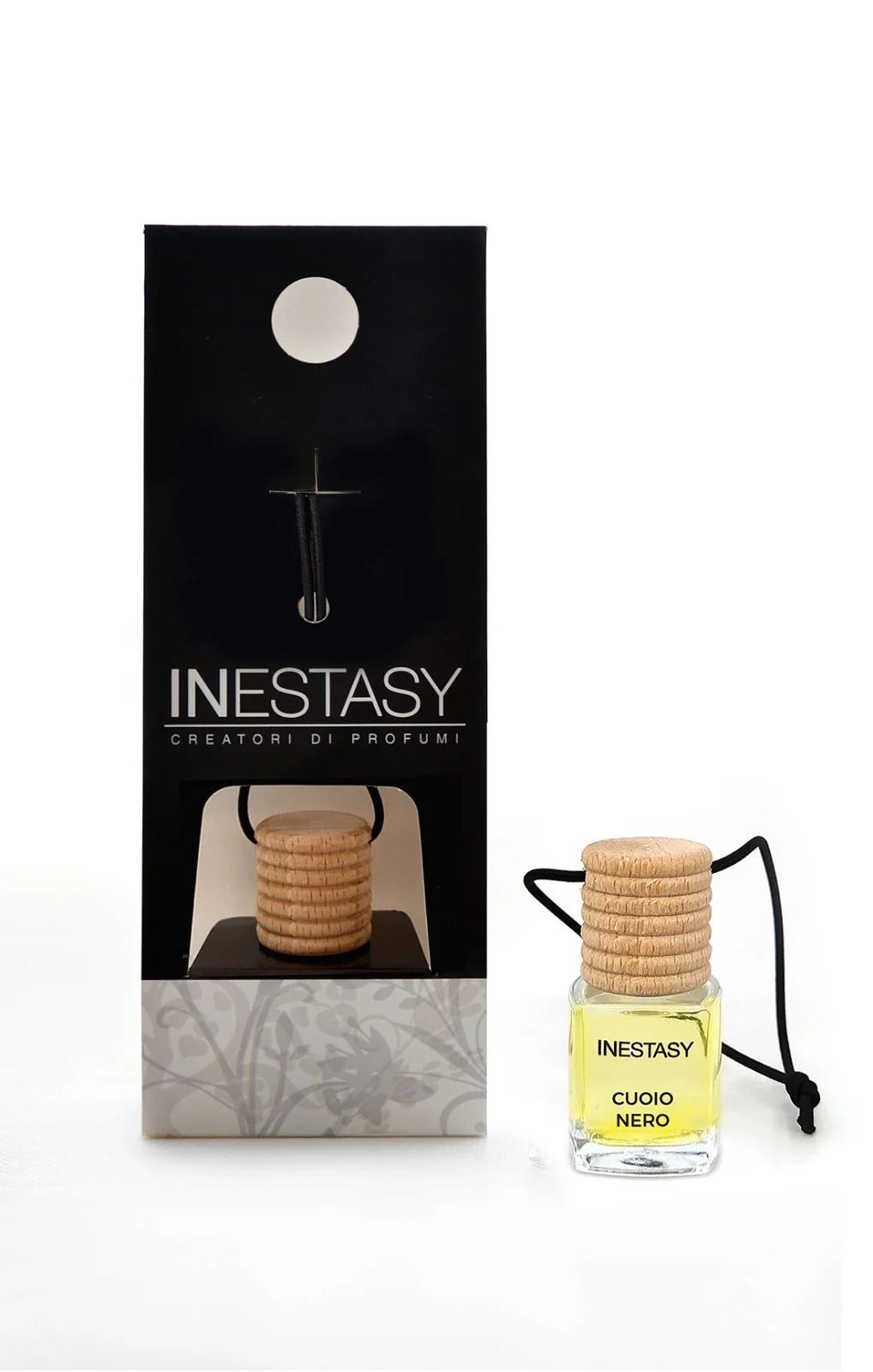 Una bottiglia di deodorante per auto Inestasy accanto a una scatola.