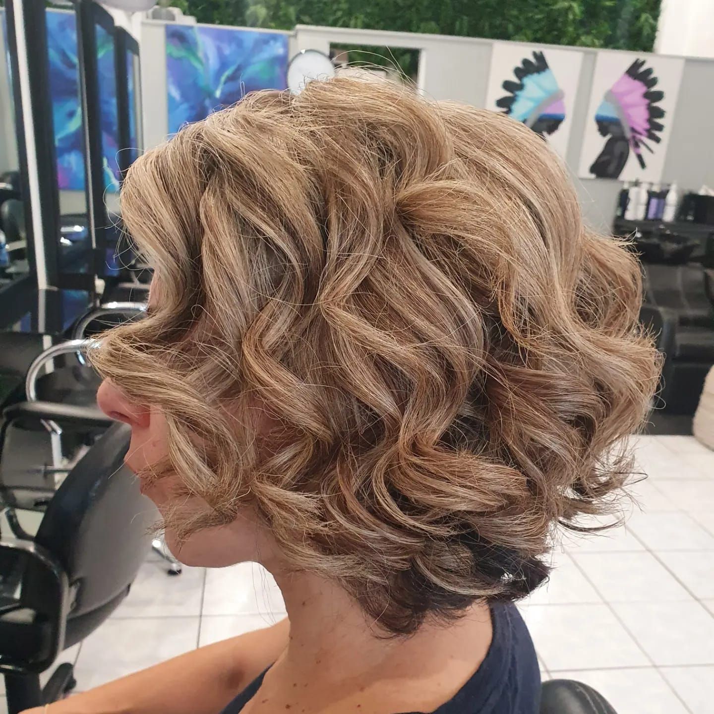 Woman With Curly Blonde Bob Hairstyle in a Salon — ClaireAbella Hair Studio In Kariong, NSW