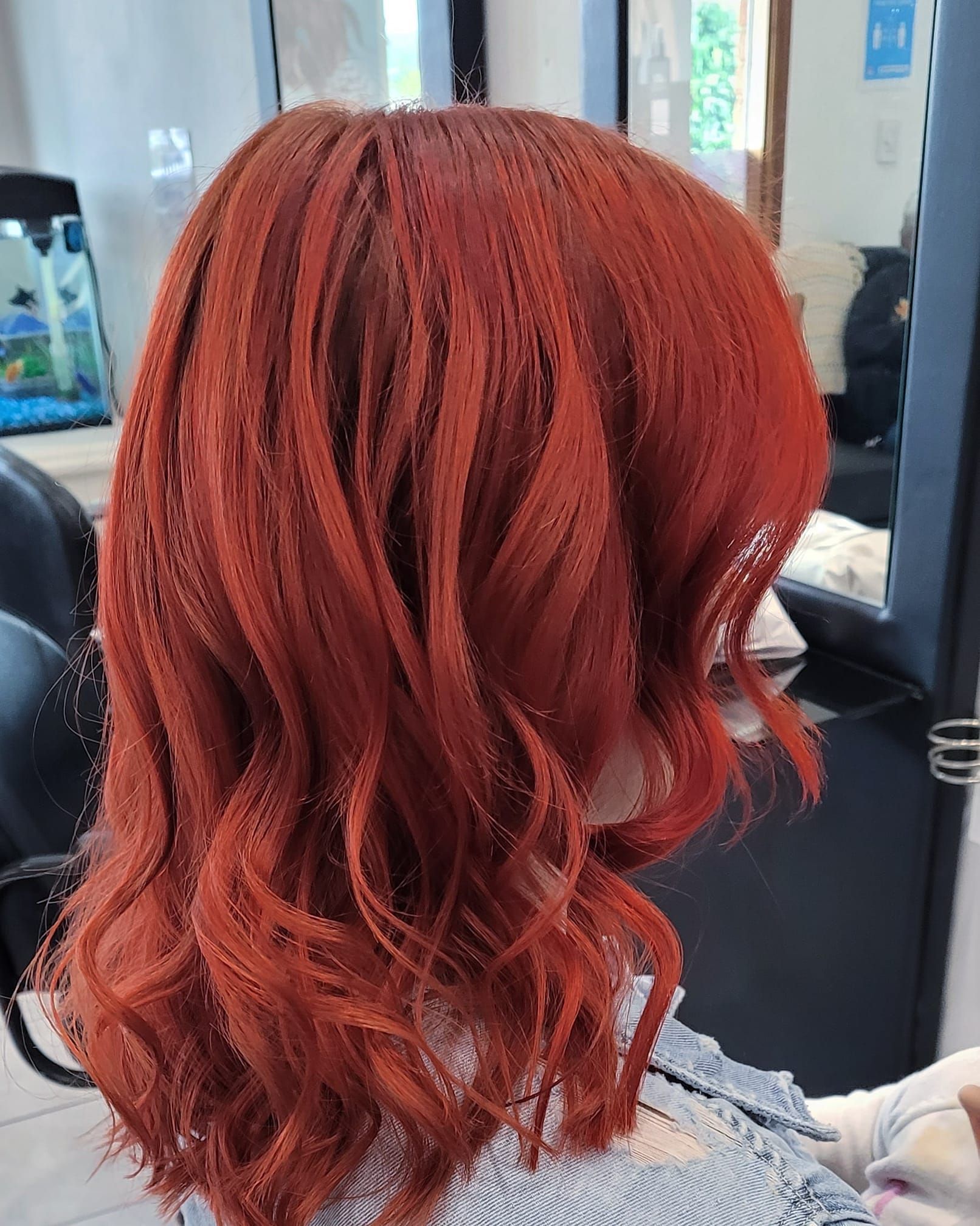 Woman With Wavy, Bright Red Hair Styled in a Salon — ClaireAbella Hair Studio In Kariong, NSW