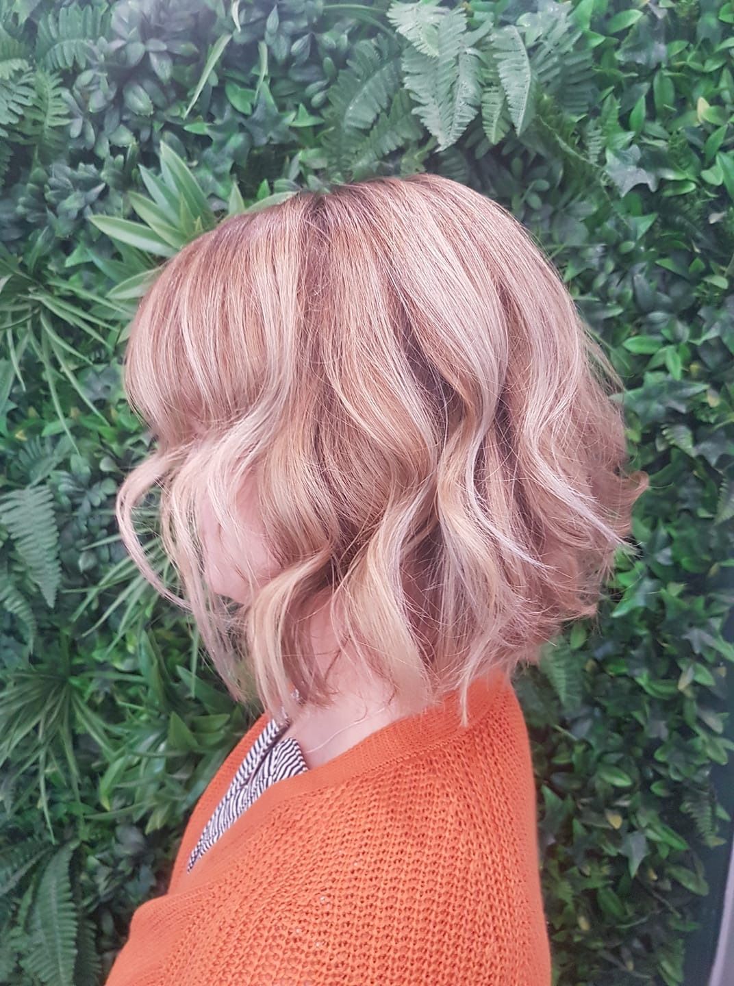 Woman With Wavy, Blonde-brown Hair, Wearing an Orange Sweater — ClaireAbella Hair Studio In Kariong, NSW