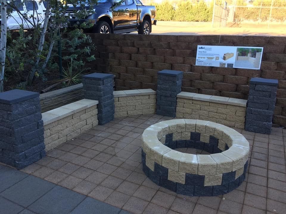 A Brick Wall With a Fire Pit in the Middle of It — Highfields Landscape Supplies In Gatton, QLD