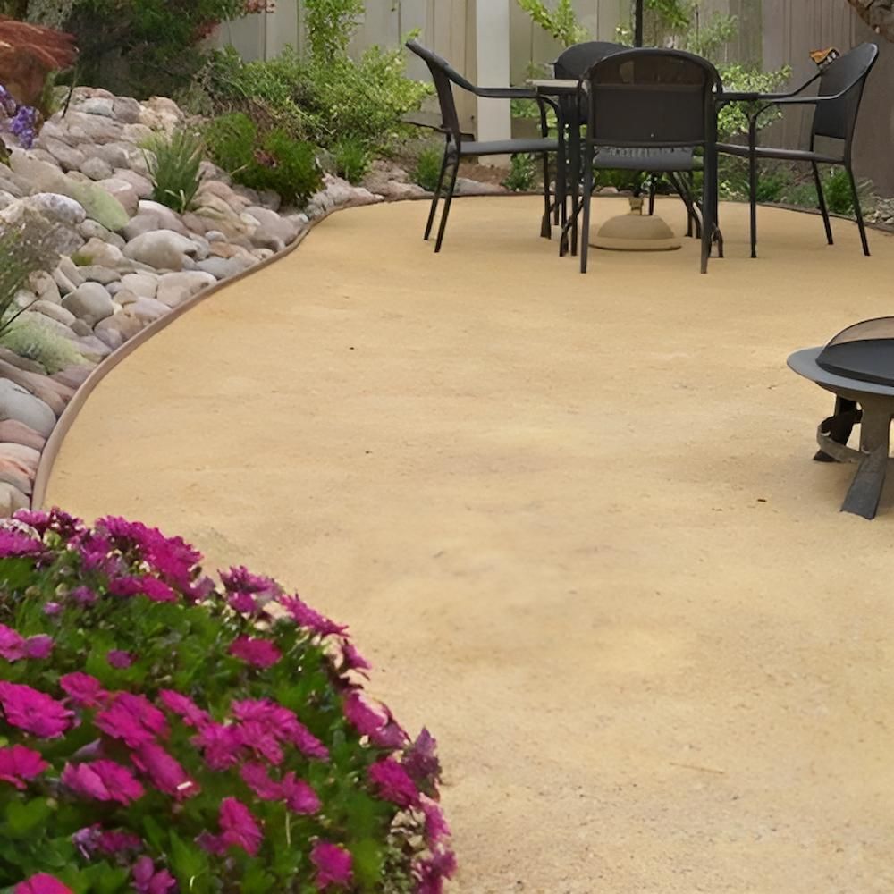 A Patio With a Table and Chairs and a Fire Pit — Highfields Landscape Supplies In Meringandan, QLD