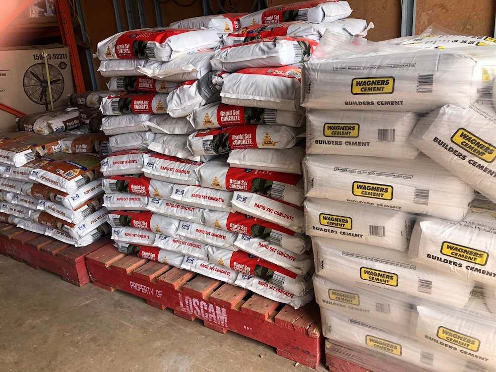 A Bunch of Bags Are Stacked on Top of Each Other in a Warehouse — Highfields Landscape Supplies In Meringandan, QLD