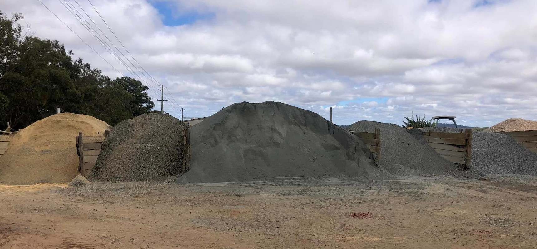 A Pile of Gravel is Sitting on Top of a Dirt Field — Highfields Landscape Supplies In Crows Nest, QLD