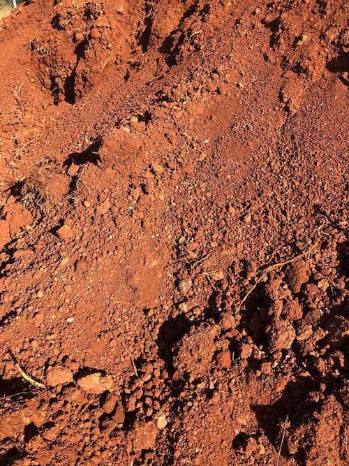 A Pile of Red Dirt With a Lot of Rocks in It — Highfields Landscape Supplies In Crows Nest, QLD