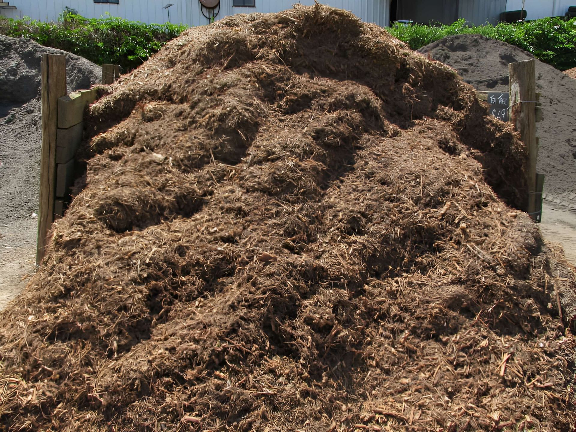 A Large Pile of Brown Dirt is Sitting on the Ground — Highfields Landscape Supplies In Dalby, QLD
